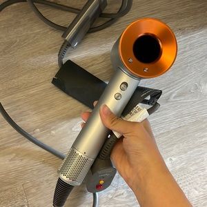 Dyson hair dryer copper edition with travel bag